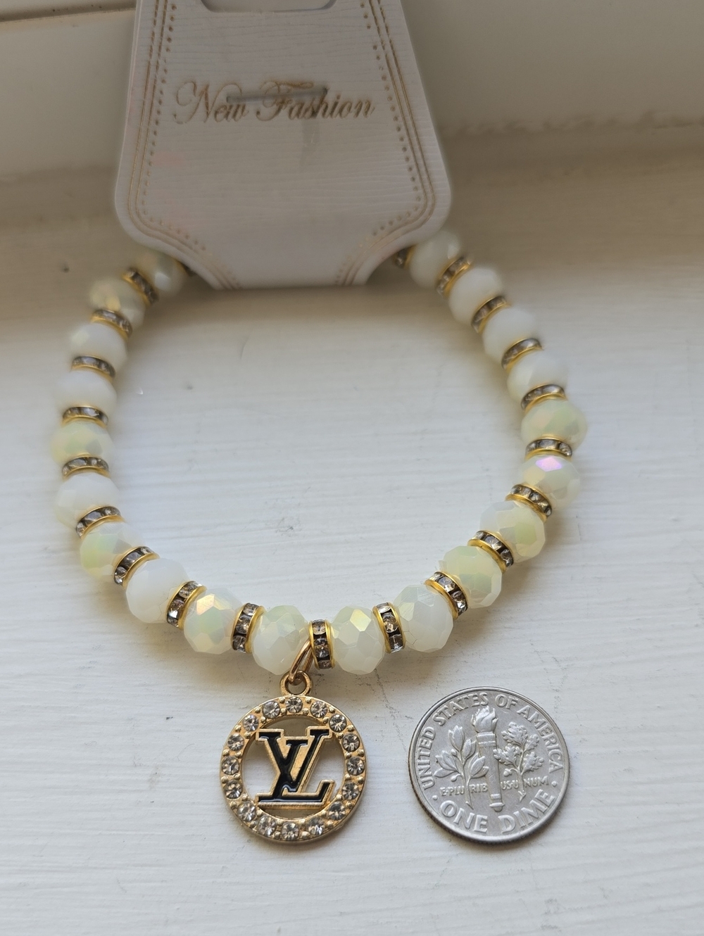 White & Gold Beaded Bracelet with Logo